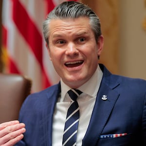 U.S. Secretary of War Pete Hegseth (R) speaks alongside U.S. President Donald Trump during a Cabinet meeting in the Cabinet Room of the White House on March 26, 2026 in Washington, DC.