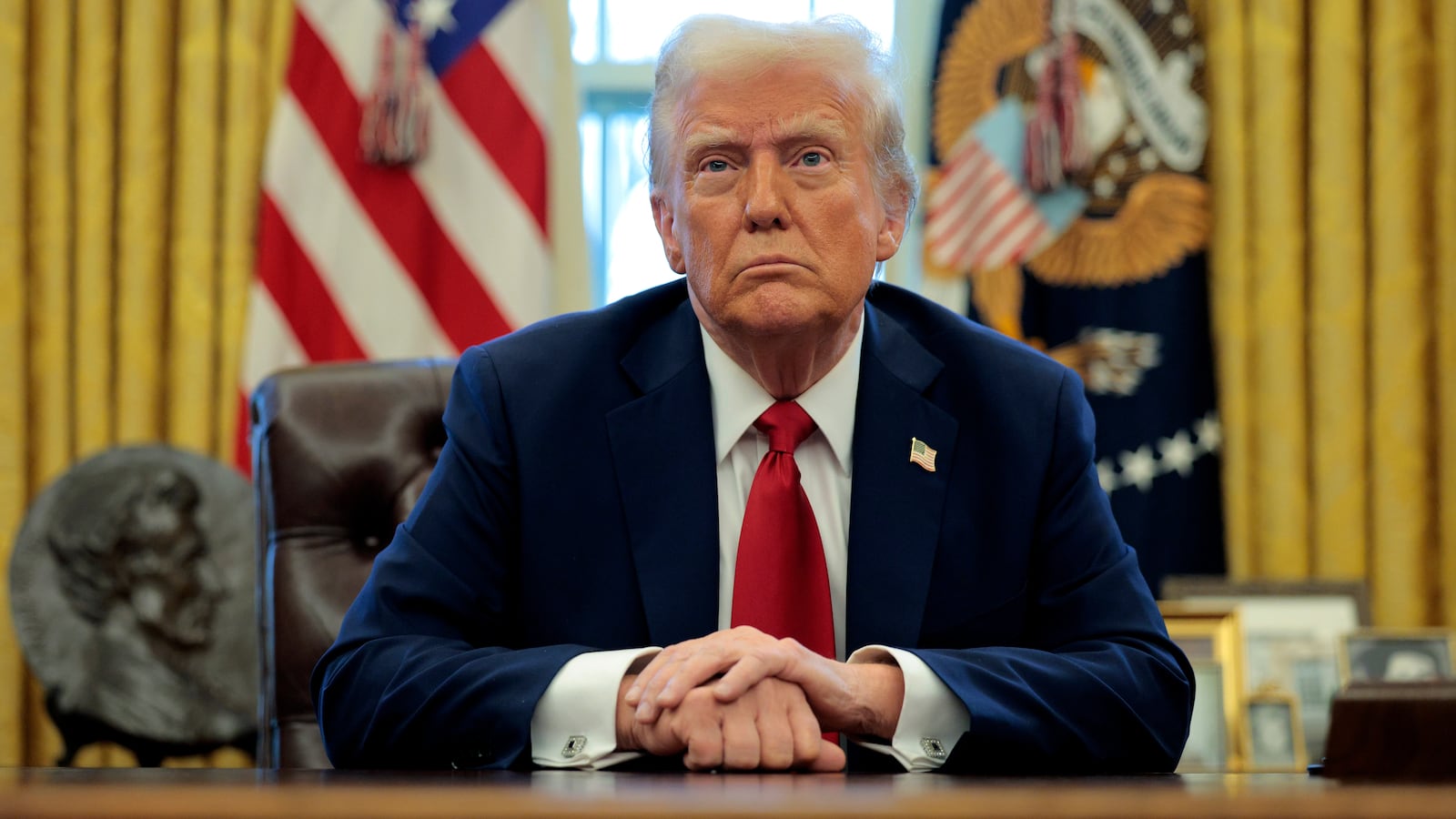 U.S. President Donald Trump talks to reporters.