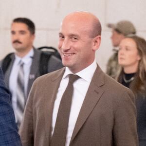 US Vice President JD Vance (L), Defense Secretary Pete Hegseth (C) and White House Deputy Chief of Staff Stephen Miller react to protesters as they leave after greetings members of the National Guard stationed at Union Station in Washington, DC, August 20, 2025.