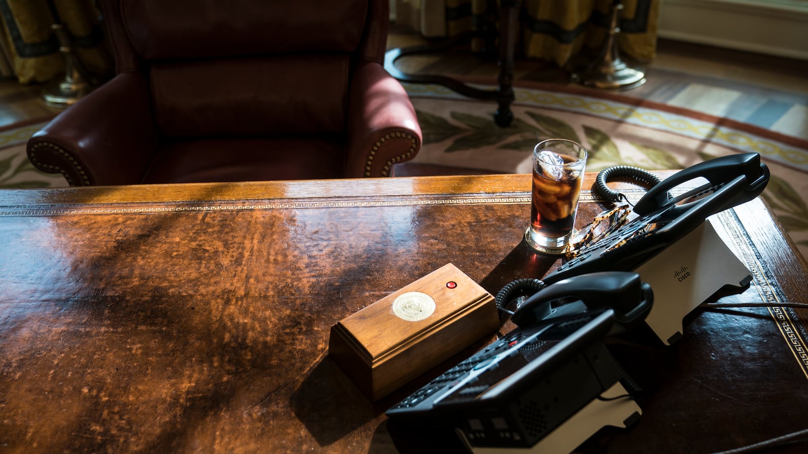 WASHINGTON, DC - FEBRUARY 14: A glass of iced soda is seen on the Resolute Desk as President Donald Trump speaks during a meeting about the opportunity zones provided by tax reform in the Oval Office of the White House in Washington, DC on Wednesday, Feb. 14, 2018. During the meeting President Trump responded to a reporter's question "I am totally opposed to domestic violence of any kind everyone knows that and it almost wouldn't even have to be said." (Photo by Jabin Botsford/The Washington Post via Getty Images)