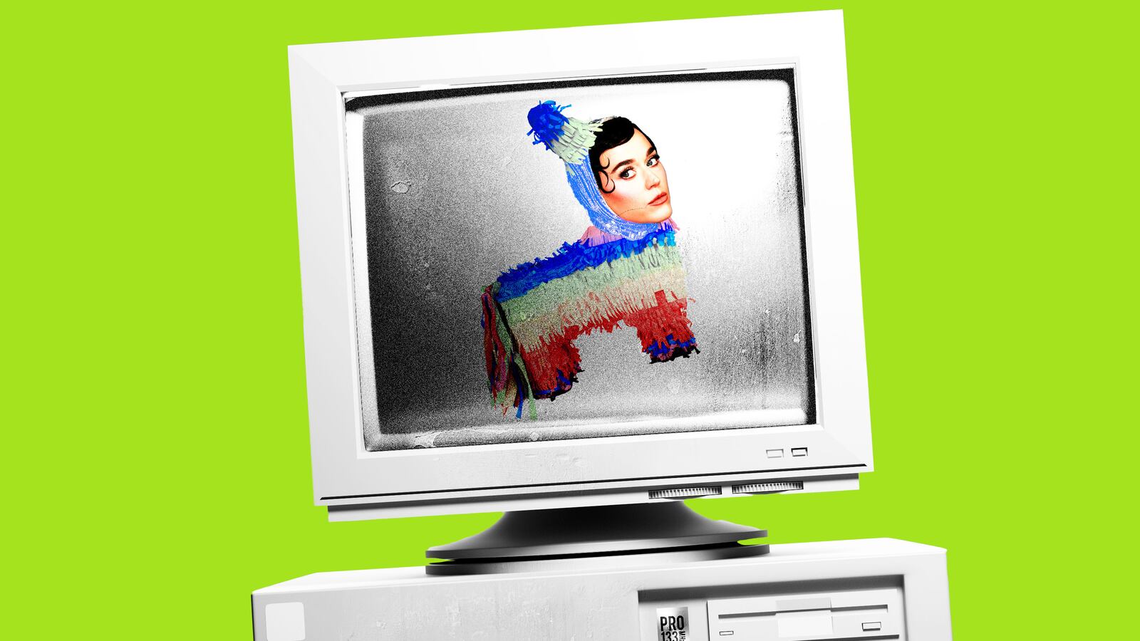 Old computer on a green background with Katy Perry's head on a pinata