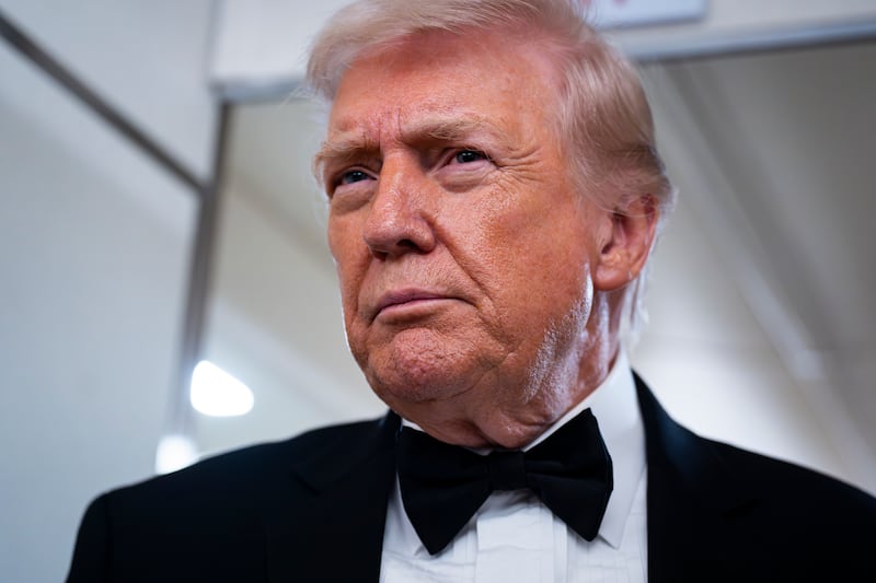 President Donald Trump speaks to reporters on board Air Force One on Jan. 31, 2026.