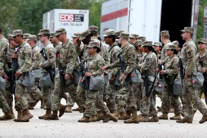 Members of the Texas National Guard assembled in Elwood, Illinois, at the Army Reserve Training Center on Tuesday.