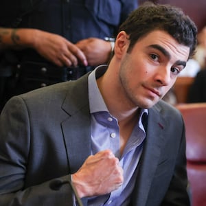 Luigi Mangione (L) appears in Manhattan Supreme Court alongside his attorney Karen Friedman Agnifilo.