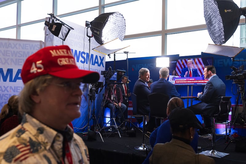 NEWSMAX television personalities listen in to former President Trump's South Carolina speech, during the Conservative Political Action Conference (CPAC) in National Harbor, Maryland, on Friday, February 23, 2024.
