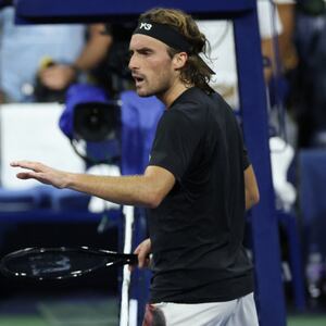Germany's Daniel Altmaier (L) and Greece's Stefanos Tsitsipas argue after shaking hands at the net after Altmaier won their men's singles second round tennis match on day five of the US Open tennis tournament at the USTA Billie Jean King National Tennis Center in New York City, on August 28, 2025. (Photo by CHARLY TRIBALLEAU / AFP) (Photo by CHARLY TRIBALLEAU/AFP via Getty Images)