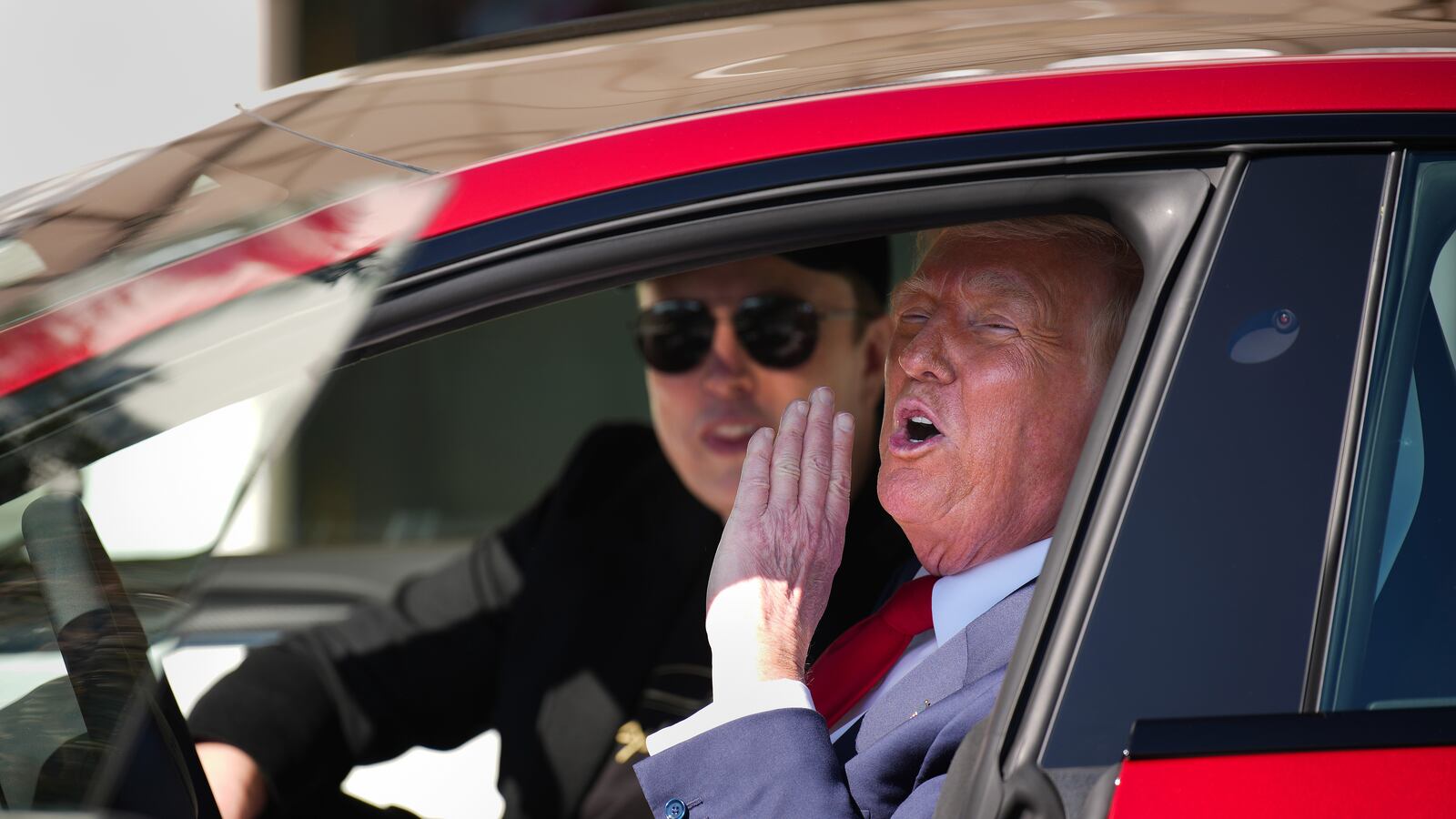 Donald Trump and White House Senior Advisor, Tesla and SpaceX CEO Elon Musk sit in a Tesla Model S on the South Lawn of the White House.