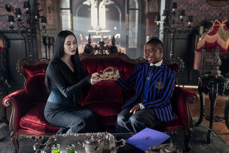Catherine Zeta-Jones as Morticia Addams and Joy Sunday as Bianca Barclay in Wednesday.