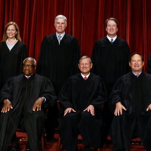 U.S. Supreme Court justices Amy Coney Barrett, Neil Gorsuch, Brett Kavanaugh, Ketanji Brown Jackson, Sonia Sotomayor, Clarence Thomas, Chief Justice John Roberts, Jr., Samuel Alito and Elena Kagan pose for a group portrait in Washington, D.C. on October 7, 2022.