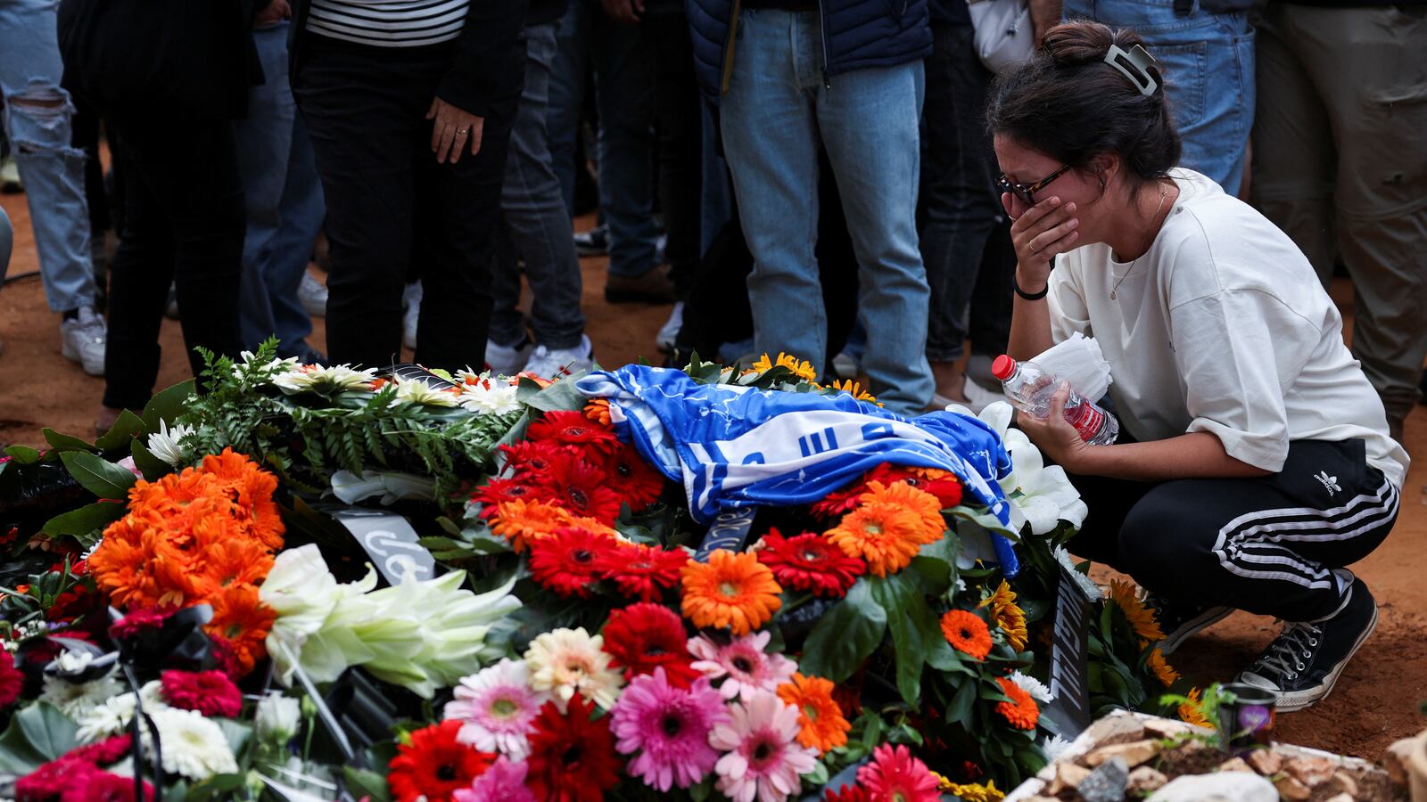 Friends and family mourn Alon Lulu Shamriz, one of three Israeli hostages who were mistakenly killed by the Israeli military while being held hostage in Gaza by Hamas, at his funeral in Shefayim, Israel, Dec. 17, 2023.