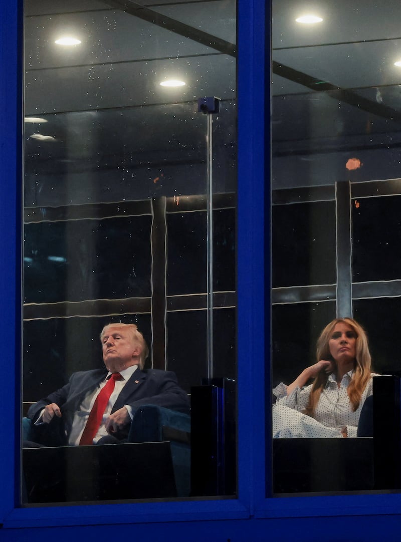 U.S. President Donald Trump and first lady Melania Trump watch fireworks explode during the Freedom 250's Salute to America as the United States celebrates its 250th anniversary on Independence Day, attempting the largest firework display in history with 850,000 fireworks in Washington, D.C., U.S., July 5, 2026. REUTERS/Jonathan Ernst