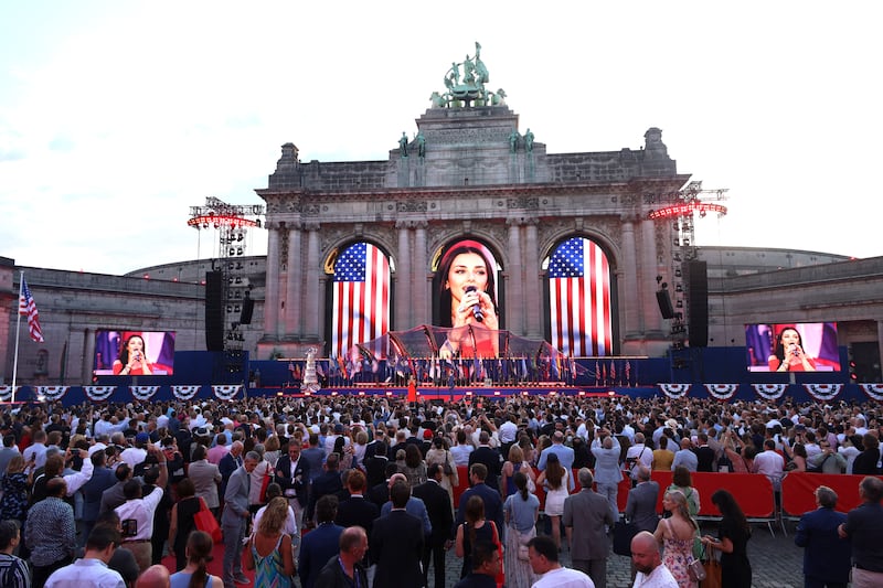 Wilkins performing at the event organized by the U.S. Mission to Belgium to mark the 250th anniversary of American independence, at Cinquantenaire Park, in Brussels, Belgium—several groups protested the event.