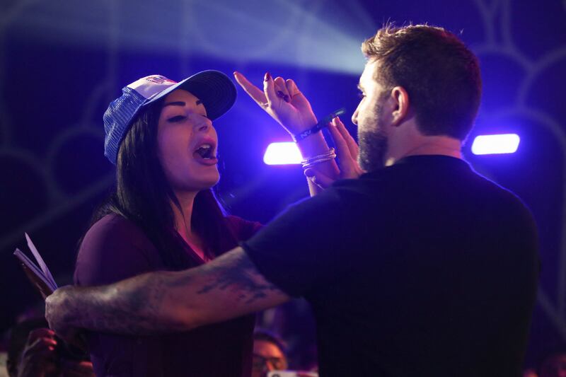 Republican activist Laura Loomer shouts at Jack Dorsey creator, co-founder, and Chairman of Twitter and co-founder & CEO of Square, as he speaks on stage during the crypto-currency conference Bitcoin 2021 Convention at the Mana Convention Center in Miami, Florida, on June 4, 2021.