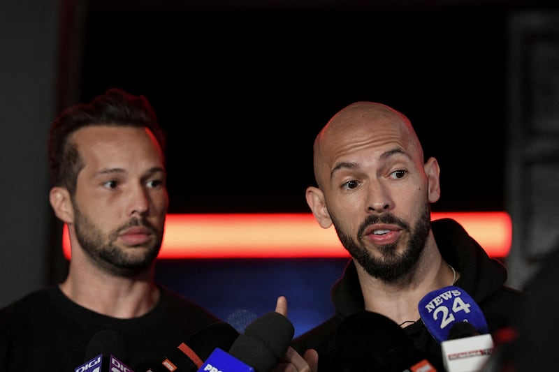 FILE PHOTO: Tristan and Andrew Tate deliver a press statement in front of their house after landing back in Romania, near Bucharest, Romania, March 22, 2025.