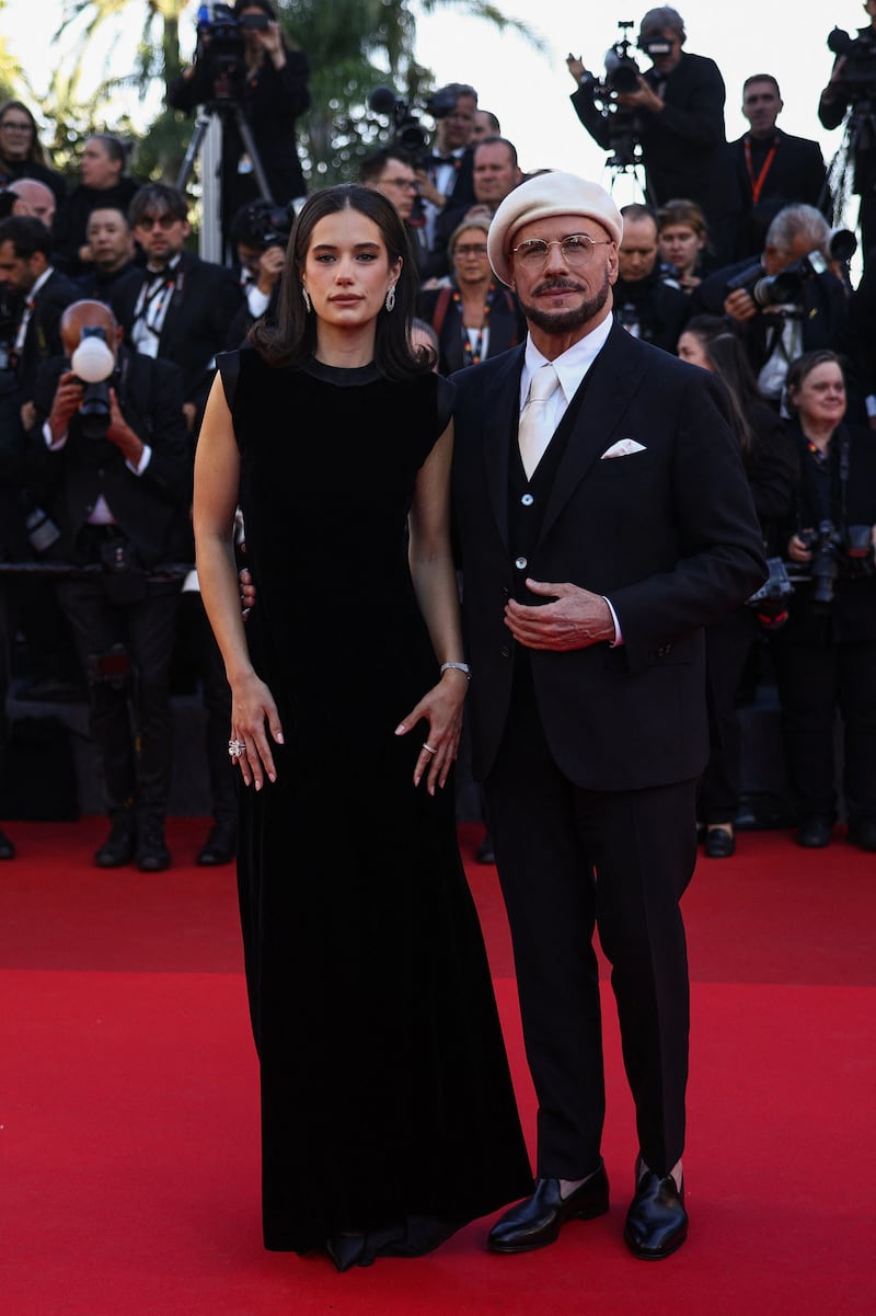 Director John Travolta and his daughter Elle Bleu Travolta pose on the red carpet ahead of the premiere of "Propeller One-Way Night Coach."