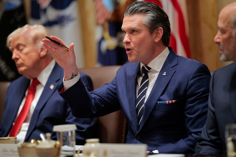 Trump with his eyes closed as Defense Secretary Pete Hegseth delivers remarks during the Cabinet meeting at the White House on March 26, 2026.