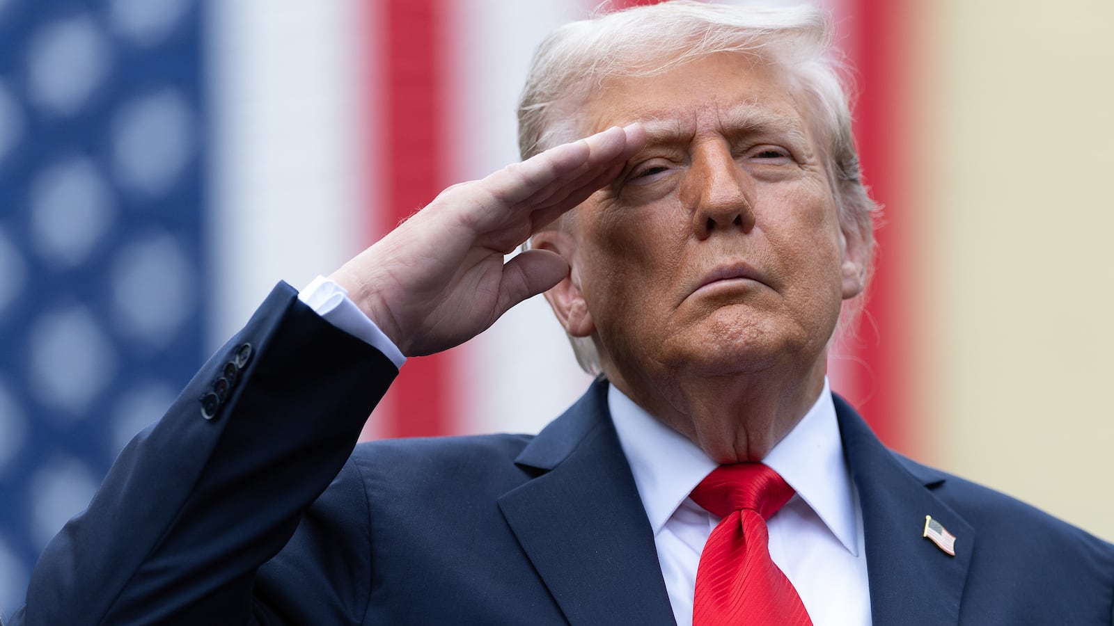 President Donald Trump salutes during the playing of "Taps" at a September 11th observance event in the courtyard of the Pentagon September 11, 2025 in Arlington, Virginia.