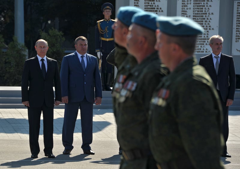 Russian President Vladimir Putin (L), accompanied by Defence Minister Anatoly Serdyukov (2nd L), visits the base of the independent airborne assault brigade number 31, on the eve of the Paratroopers' Day, in the city of Ulyanovsk on the Volga River August 1, 2012.  REUTERS/Alexei Nikolskyi/RIA Novosti/Pool (RUSSIA - Tags: POLITICS MILITARY ANNIVERSARY) THIS IMAGE HAS BEEN SUPPLIED BY A THIRD PARTY. IT IS DISTRIBUTED, EXACTLY AS RECEIVED BY REUTERS, AS A SERVICE TO CLIENTS
