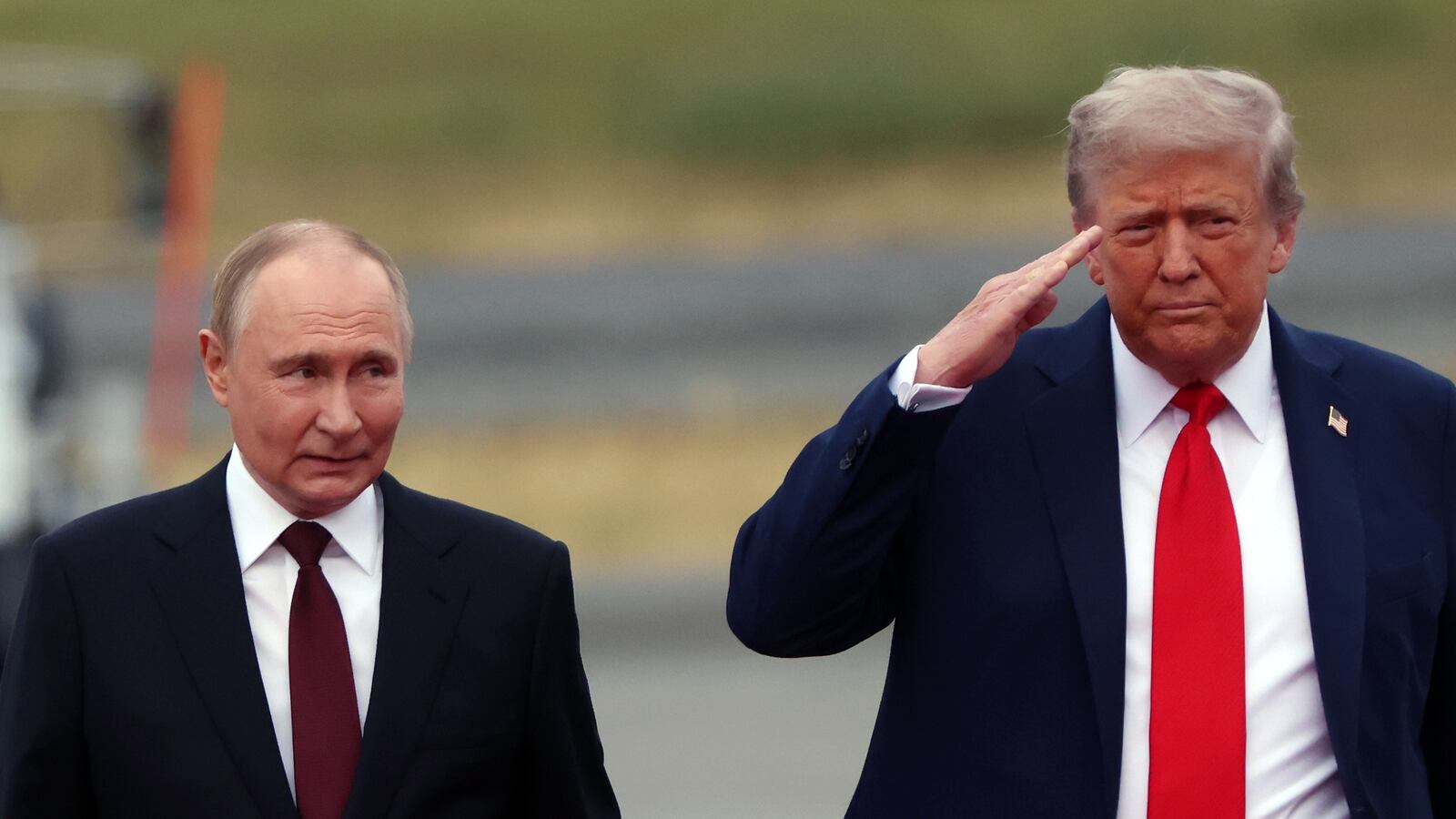 ANCHORAGE, ALASKA - AUGUST 15: (RUSSIA OUT) U.S. President Donald Trump welcomes Russian President Vladimir Putin to Joint Base Elmendorf-Richardson on August 15, 2025 in Anchorage, Alaska. The two leaders are meeting for peace talks aimed at ending the war in Ukraine. (Photo by Contributor/Getty Images)