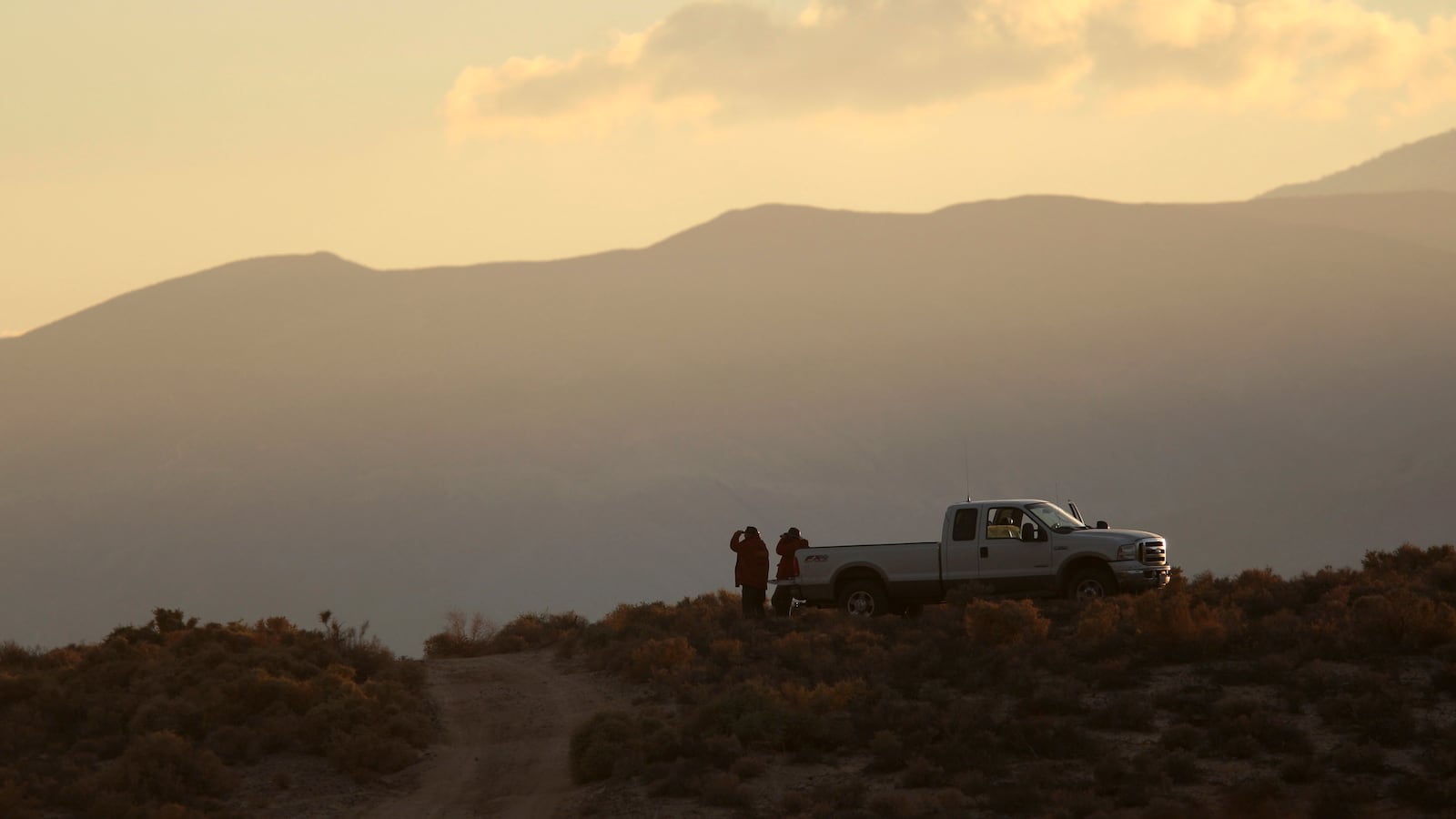 Sheriff’s deputies near an unmarked pickup truck in California’s Mojave Desert.