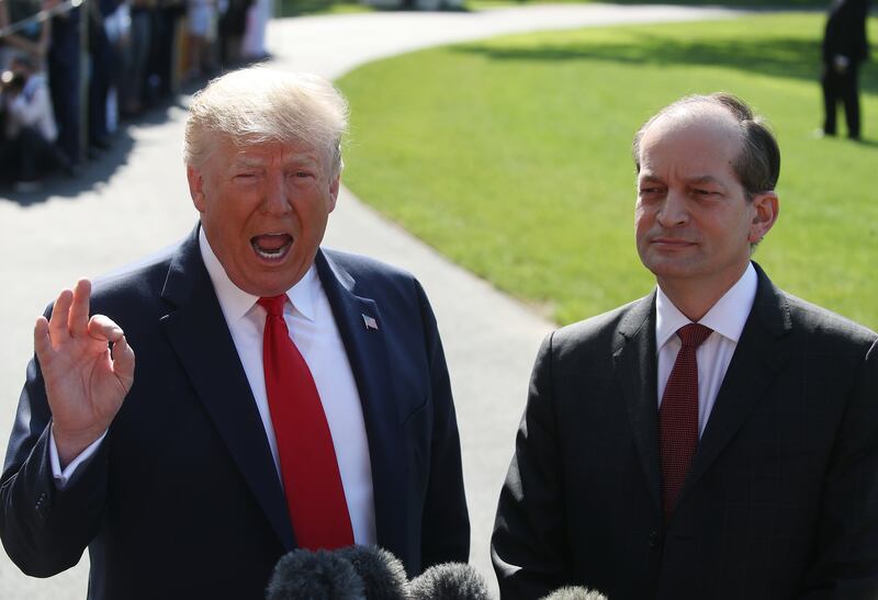 President Donald Trump standing with Labor Secretary Alex Acosta in July 2019 after he announced his resignation amid questions over his role in the Jeffrey Epstein plea deal a decade earlier.