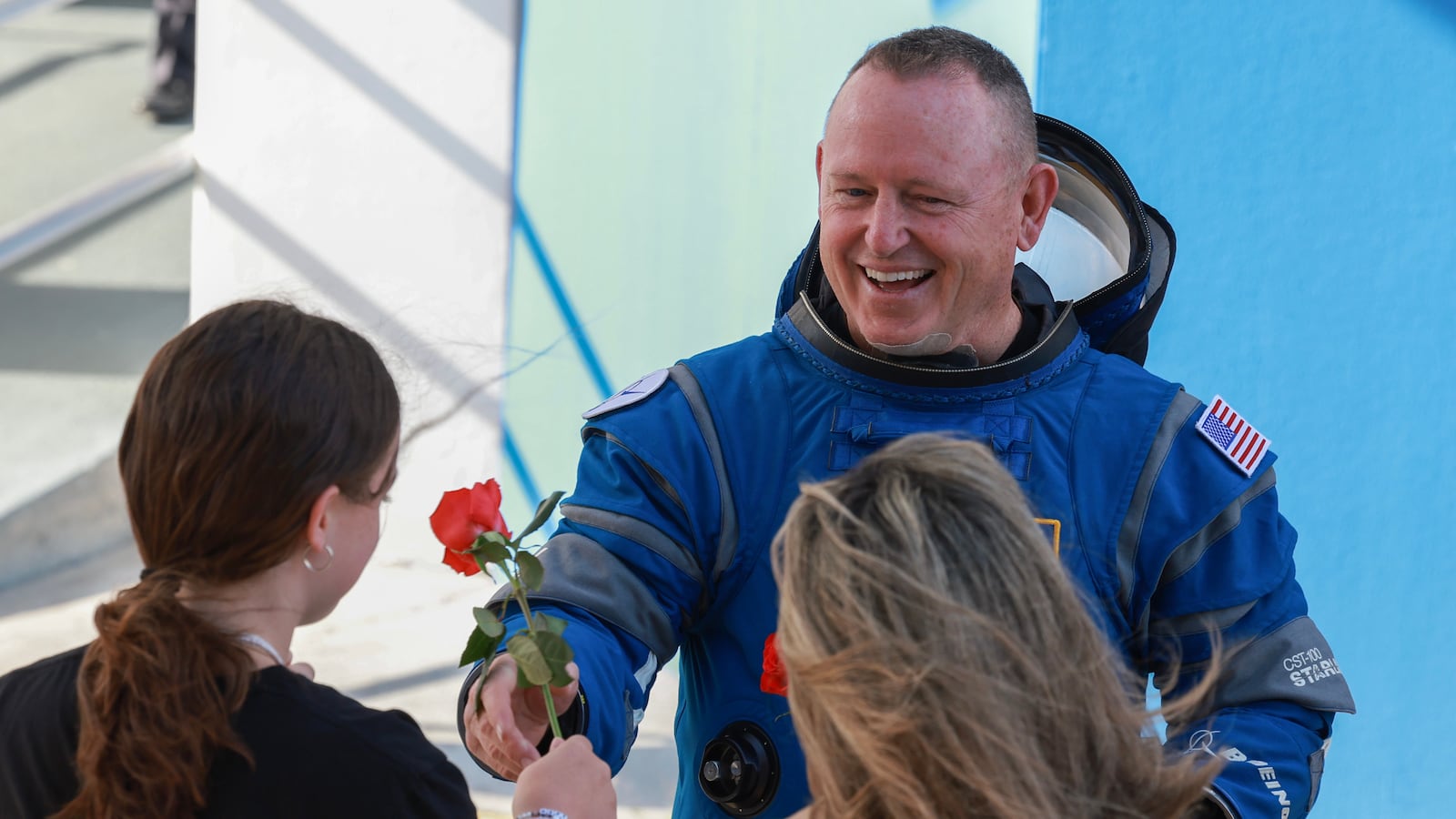 NASA’s Boeing Crew Flight Test Commander Butch Wilmore greets people as he walks out of the Operations and Checkout Building on June 01, 2024 in Cape Canaveral, Florida.