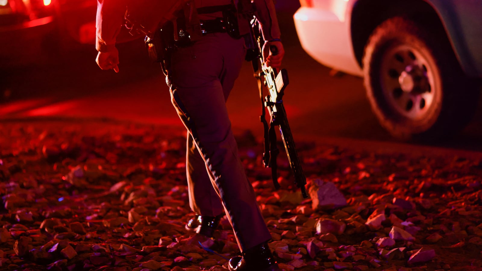 A law enforcement member walks outside the Cielo Vista Mall after a shooting, in El Paso, Texas.