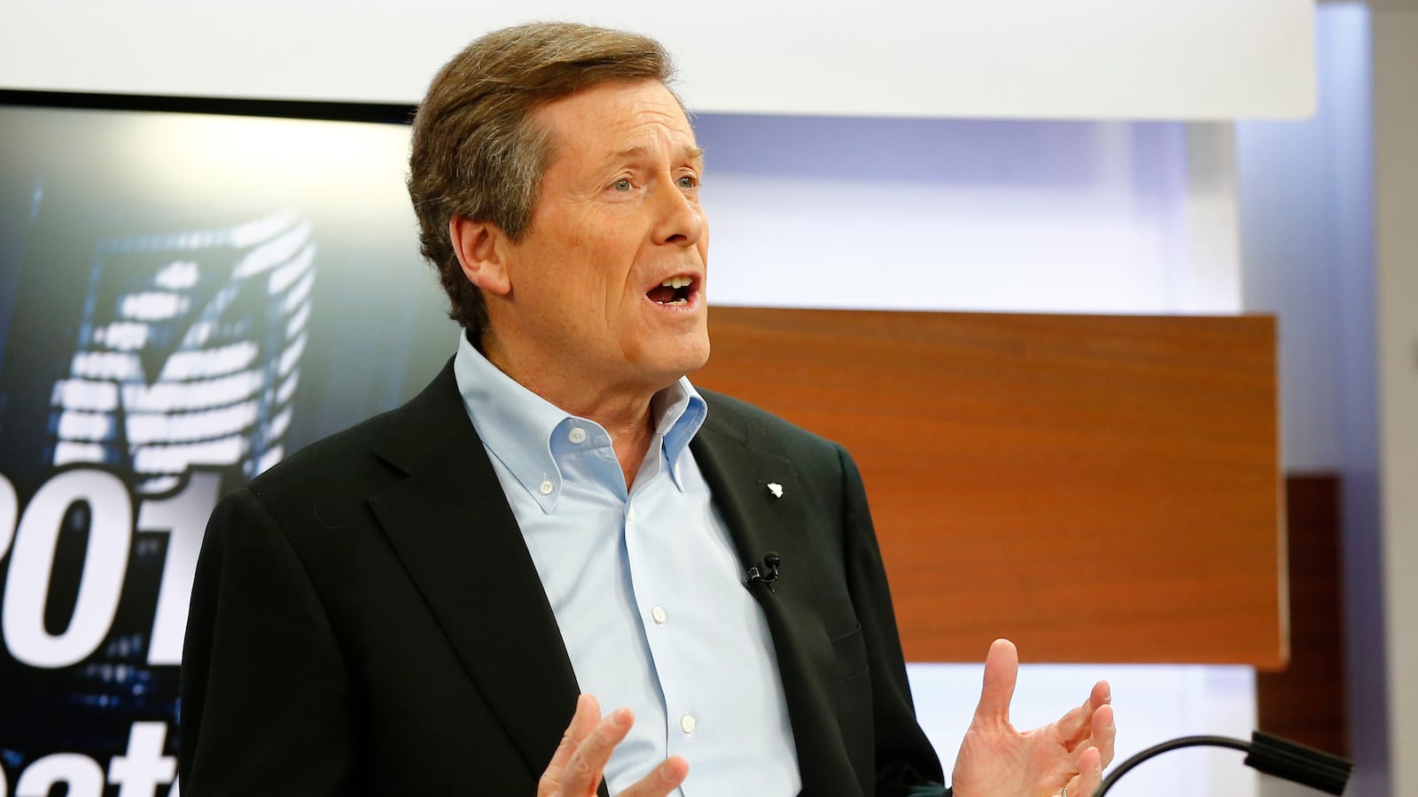 John Tory speaks at a podium.