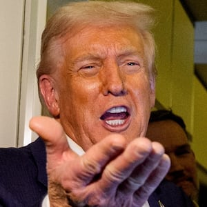 President Donald Trump, accompanied by U.S. Secretary of State Marco Rubio (R) and U.S. Treasury Secretary Scott Bessent (L), speaks to members of the media aboard Air Force One on October 27, 2025, in flight. Trump is in route to Japan after attending the Association of Southeast Asian Nations (ASEAN) summit in Malaysia,