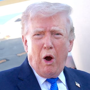 President Donald Trump speaks to the media before departing West Palm Beach aboard Air Force One, Florida, U.S., March 23, 2026.