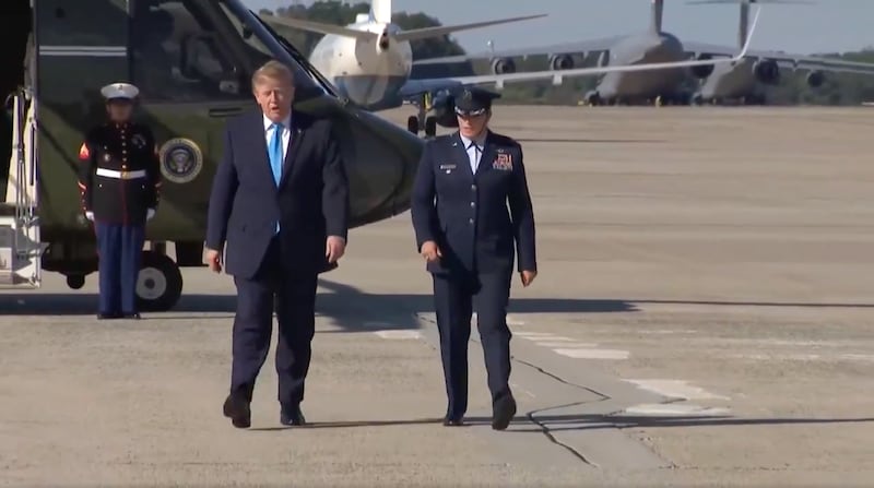 Trump's right leg swoops out wide, causing him to correct course.