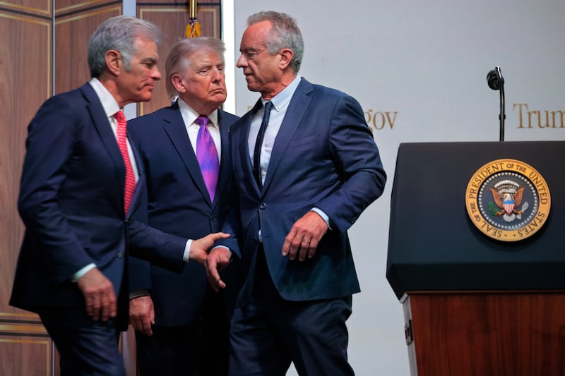 Centers for Medicare & Medicaid Services Administrator Mehmet Oz, U.S. President Donald Trump and Health and Human Services Secretary Robert F. Kennedy Jr. hold a news conference about the government prescription drug program TrumpRx.gov in the Eisenhower Executive Office Building on May 18, 2026 in Washington, DC.