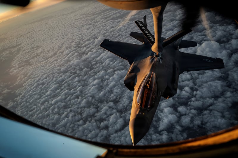 A U.S. Air Force KC-135 Stratotanker aircraft refuels a U.S. Air Force F-35A Lightning II aircraft during the Operation Epic Fury attack on Iran at an undisclosed location in the U.S. Central Command area of responsibility April 5, 2026