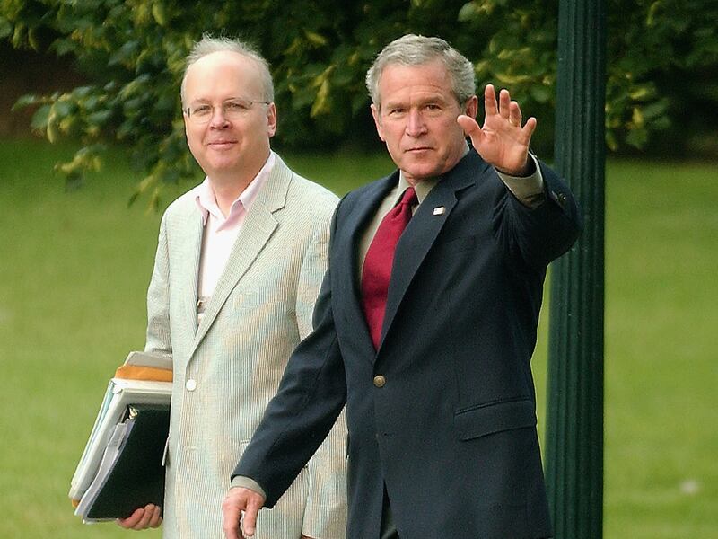 WASHINGTON, D.C. - JULY 4: United States President George W. Bush, accompanied by senior advisor Karl Rove, waves to the cameras as he prepares to depart the south lawn of the White House via Marine One to visit the United States Army Special Command in Fort Bragg, North Carolina July 4, 2006 in Washington, D.C.  The President is visiting Fort Bragg to celebrate Independence Day. (Photo by Ron Sachs - Pool/Getty Images)