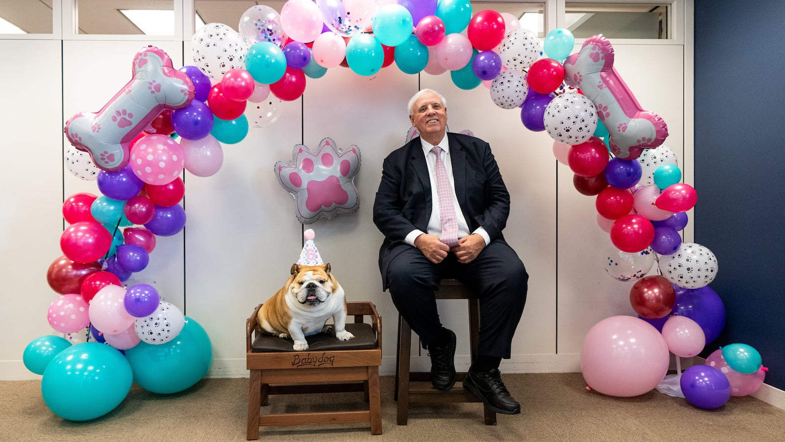 UNITED STATES - OCTOBER 15: Sen. Jim Justice, R-W.Va., and Babydog pose for photos during Babydog's 6th birthday party in the Sen. Justice's office in the Hart Senate Office Building on Wednesday, October 15, 2025. Hundreds of hill staffers waited in line to take photos with Babydog and to wish her a happy birthday. (Bill Clark/CQ-Roll Call, Inc via Getty Images)